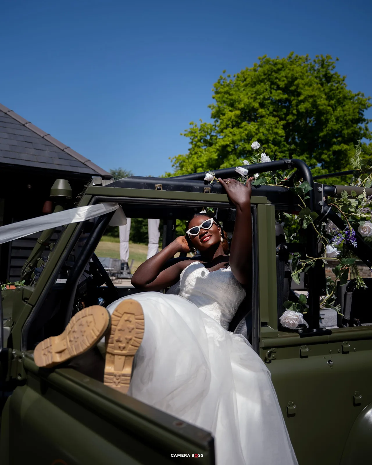 Sequence of images showing a person in a white wedding dress peeking through a military vehicle window.