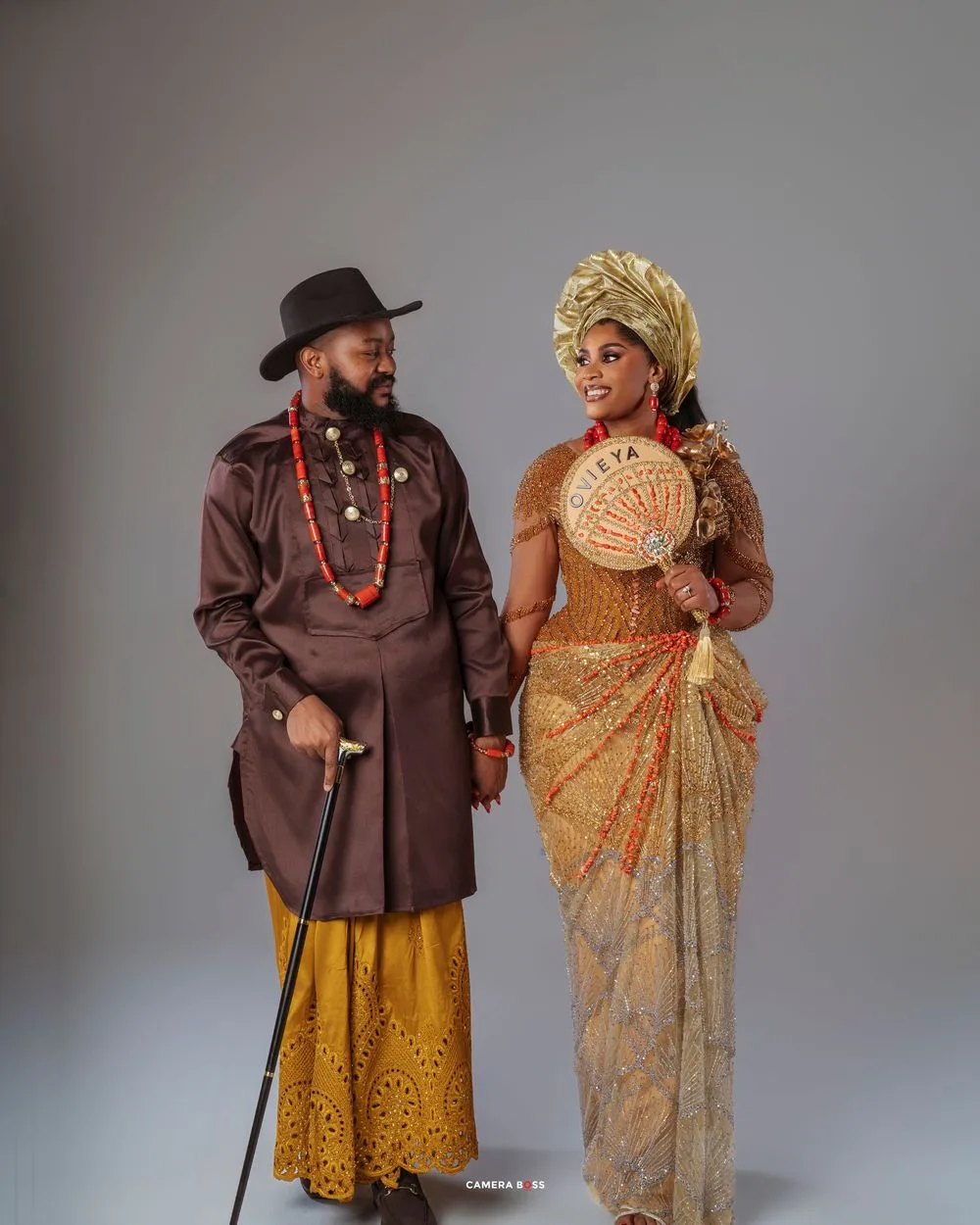 Traditional Navajo figures in ceremonial dress pose in a series of artistic studio portraits against a gray backdrop.