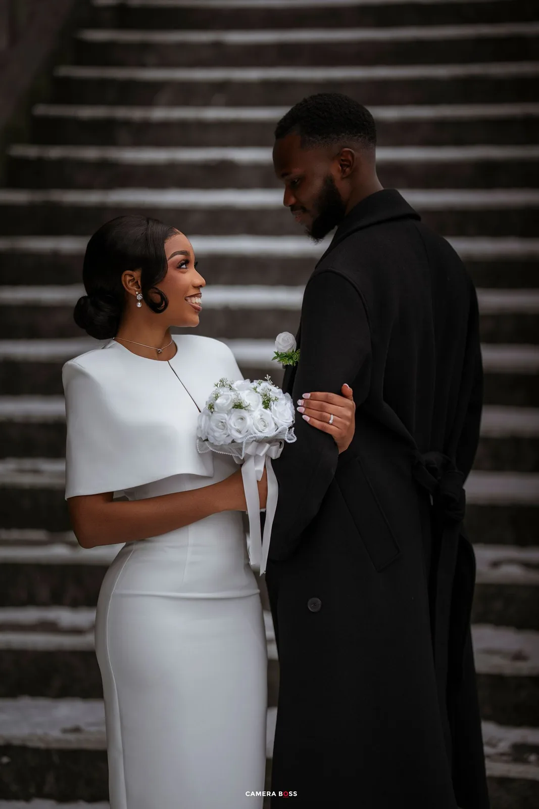 A romantic wedding photo sequence showing a couple in white dress and black suit embracing on stone steps.